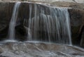 Stream Of Water Washes Over Edge Of Boulder Along The Tuolumne River Royalty Free Stock Photo