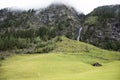 Stream waterfalls from Kaunertaler Glacier lake on mountain