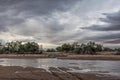 Stream on the way to the Namibia Desert, Stormy sky. Royalty Free Stock Photo