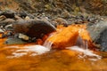 Streambed in orange color with stones