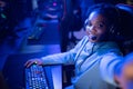 Streamer beautiful African American girl make selfie photo professional gamer playing online games computer, neon color