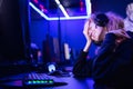 Streamer beautiful girl regrets losing professional gamer loser playing online games computer, neon color