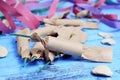 streamers, confetti and firecrackers on a rustic blue wooden surface