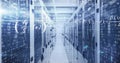 Streaming binary math overlays in data center corridor lining server racks blinking LEDs and cables Royalty Free Stock Photo