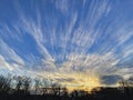 Streaming Clouds at Sunset in Winter Royalty Free Stock Photo