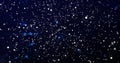 Streaming cluster of white particles with blue glowing dots in virtual space, with light trails Royalty Free Stock Photo