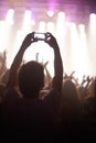 Streaming, concert and hands of audience with phone for pictures, celebration and enjoying stage, music or event. Party Royalty Free Stock Photo