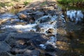 Streaming river water flowing down and over rocks, British-Columbia, Canada