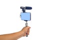 Streaming video live with smart phone and microphone tool Royalty Free Stock Photo