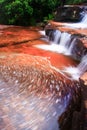 Streamlet falling on layers of sandstone pool