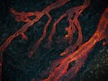 Streams of red hot lava flowing during a volcano eruption, aerial shot Royalty Free Stock Photo