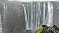 Streams of water flow down from the edge of the plateau into the abyss. Royalty Free Stock Photo