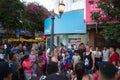 Street actor performs in front of people in city center. Large crowd of people is listening to artist`s monologue Royalty Free Stock Photo