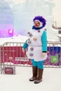 Street actress in carnival costume pose for photos by Ice figures in Moscow.