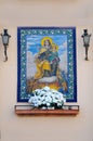 Street altar with picture of mother Mary and the infant Jesus