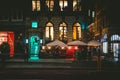 Street of Amsterdam during the night. Tourists, coffe shops, bicycle parking and colorful city lights Royalty Free Stock Photo