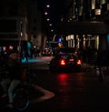 Street of Amsterdam during the night. Tourists, coffe shops, bicycle parking and colorful city lights Royalty Free Stock Photo