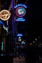 Street of Amsterdam during the night. Tourists, coffe shops, bicycle parking and colorful city lights