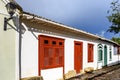 Street with ancient colonial style houses with colorful doors and windows