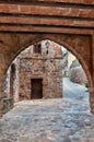 Street with an arch, Collbato, Spain Royalty Free Stock Photo