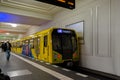 Street art. Abstract background image of a full completed graffiti painting in beige and orange tones with the subway train. Royalty Free Stock Photo