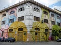 Street art of a building with colored diabolic faces to Rome in Italy.