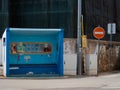 Street art on a bus stop shelter. Old women drying clothes on the line. Bra and slip underwear in Lagos