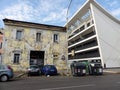 Street art of chained cars in the facade of a house to Rome in Italy.