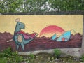 Street art. Colorful graffiti on a concrete fence by unknown authors. Saint-Petersburg