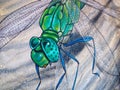 Street art in Duesseldorf - graffiti of a beautiful green dragonfly