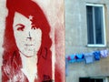 Street art and urban life - female face, Genoa, Italy