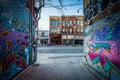 Street art in Graffiti Alley and buildings on Queen Street West, in the Fashion District of Toronto, Ontario.