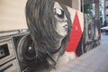 Street art graffiti of a girl listening to music Royalty Free Stock Photo