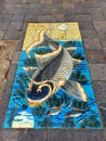 Street art on Hanoi sidewalk Vietnam. Fish