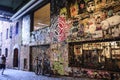Street art posted in post alley at pike place market gum wall