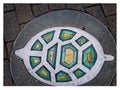 Colorful figurines decorate stoned sidewalk of downtown Austin, Texas. Royalty Free Stock Photo