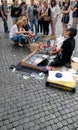 Street Art. A talented woman shows proudly her painting work to her audiences.