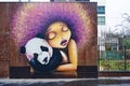 Street art wall painting of a girl with a panda in Paris Royalty Free Stock Photo