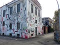 Street art of a building with quotations and handwritings to Rome in Italy.