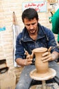 Street artisian making clay pots on pottery wheel Royalty Free Stock Photo