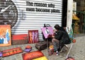 Street artist draws and sells paintings in Belgium