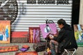 Street artist draws and sells paintings in Belgium