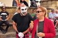 Italian clown street artist in Italy performing in front of a crowd in Florence city