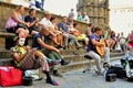 Italians enjoying a summer day in Florence , Italy with street artists and spectators