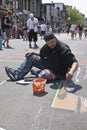 Street artist painting the road at the Toronto Gay