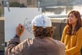 Street artist paints a beautiful girl in Prague Royalty Free Stock Photo