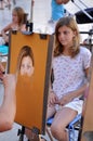 Street artist paints the portrait of a young girl. Zadar, Croatia Royalty Free Stock Photo