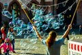 Street artist produces many large soap bubbles on the Roman market square