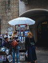 Street artist selling souvenir in the medieval old town people looking Innsbruck, Austria, Tyrol
