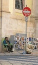 The street artist will sell their own work on street Lisbon (Portugal). Royalty Free Stock Photo